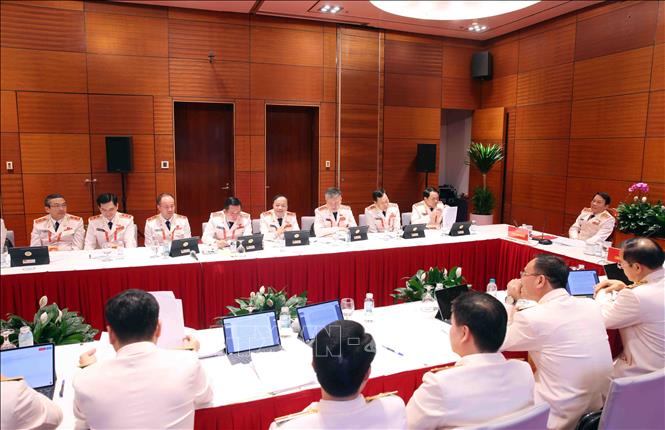 Đoàn đại biểu Đảng bộ Công an Trung ương thảo luận các văn kiện Đại hội tại Đoàn. Ảnh: TTXVN