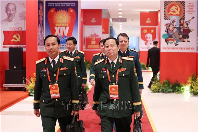 Các đại biểu đến dự phiên thảo luận tại hội trường về các văn kiện Đại hội. Ảnh: TTXVN