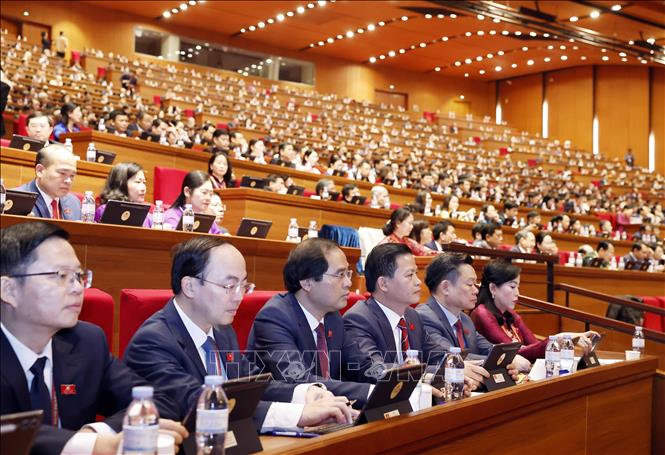 Các đại biểu dự phiên thảo luận tại hội trường về các văn kiện Đại hội, sáng 21/1. Ảnh: TTXVN