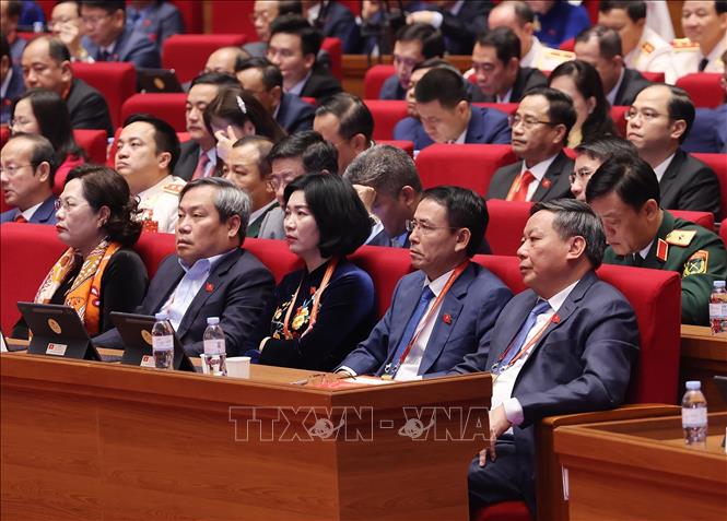 Đoàn đại biểu Đảng bộ thành phố Hà Nội dự phiên thảo luận tại hội trường về các văn kiện Đại hội, sáng 21/1. Ảnh: TTXVN