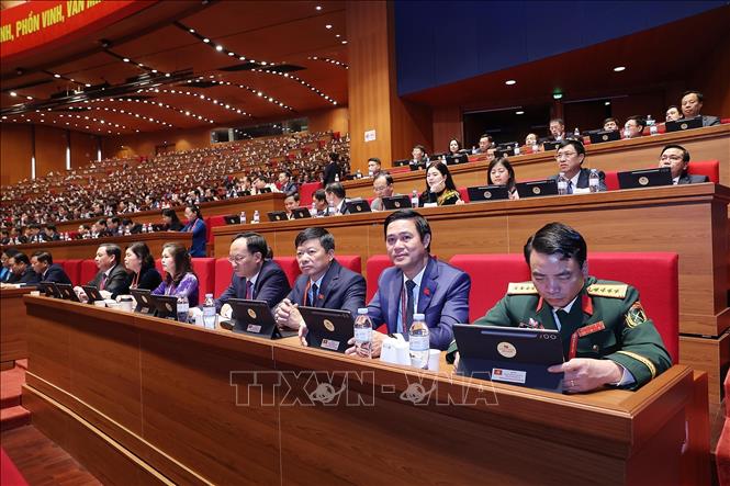 Đoàn đại biểu Đảng bộ tỉnh Bắc Ninh dự phiên thảo luận tại hội trường về các văn kiện Đại hội, sáng 21/1. Ảnh: TTXVN