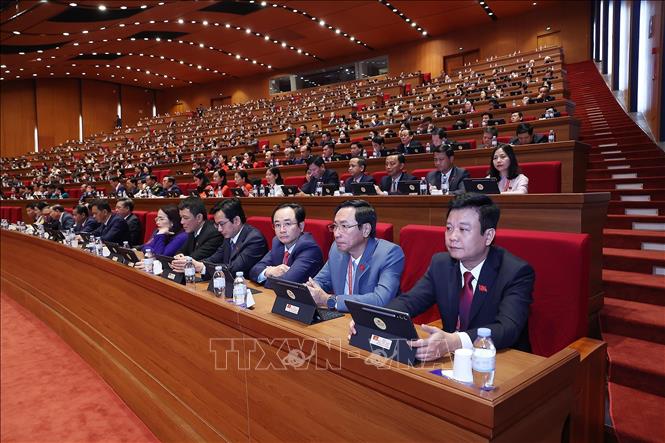 Đại biểu Đảng bộ tỉnh Quảng Trị dự phiên thảo luận tại hội trường về các văn kiện Đại hội. Ảnh: TTXVN