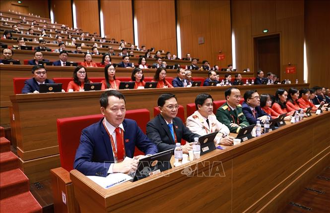 Đoàn đại biểu Đảng bộ tỉnh Đồng Nai dự phiên thảo luận tại hội trường về các văn kiện Đại hội, sáng 21/1. Ảnh: TTXVN