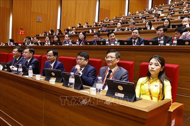 Đoàn đại biểu Đảng bộ tỉnh Thanh Hóa tham dự phiên thảo luận tại hội trường về các văn kiện Đại hội, sáng 21/1. Ảnh: TTXVN