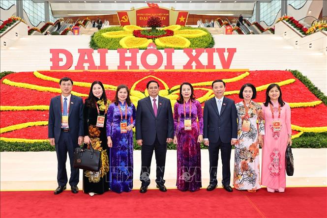 Các đại biểu đến dự phiên thảo luận tại hội trường về các văn kiện Đại hội, chiều 21/1. Ảnh: TTXVN

