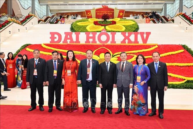 Các đại biểu đến dự phiên thảo luận tại hội trường về các văn kiện Đại hội, chiều 21/1. Ảnh: TTXVN

