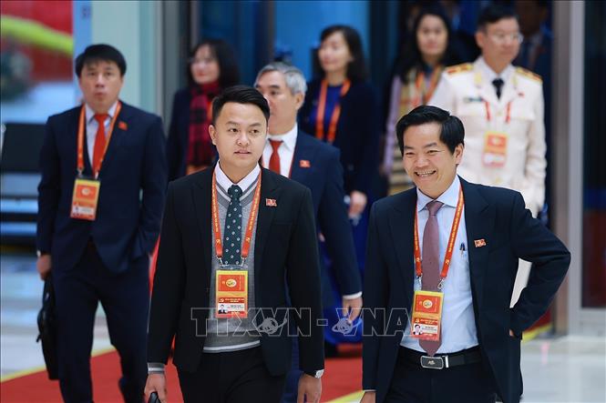 Các đại biểu đến dự ngày làm việc chính thức thứ ba Đại hội XIV của Đảng, sáng 22/1. Ảnh: TTXVN