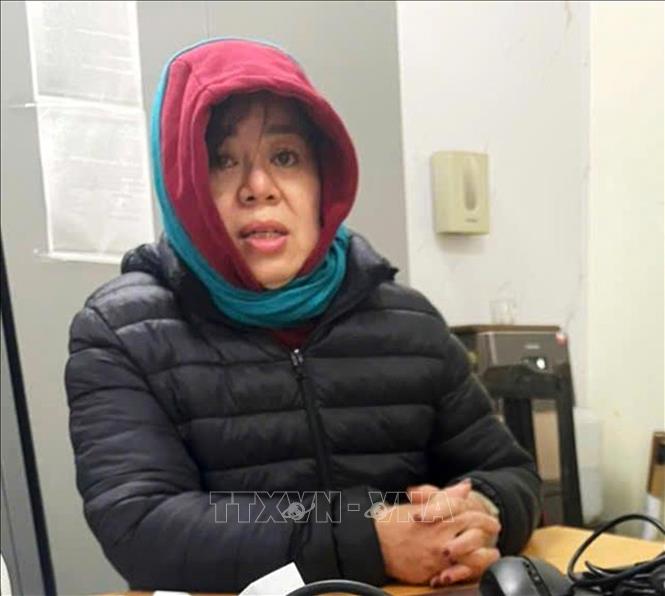 Đối tượng Nguyễn Thị Thu Nga khi bị Công an bắt giữ. Ảnh: TTXVN phát