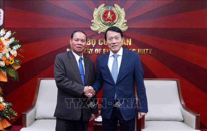 Đại tướng Lương Tam Quang, Bộ trưởng Bộ Công an Việt Nam với Thường trực Ban Bí thư Trung ương Đảng Nhân dân Cách mạng Lào Vilay Lakhamphong. Ảnh: Phạm Kiên - TTXVN