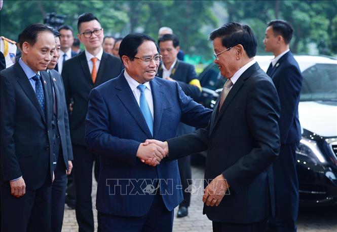 Thủ tướng Phạm Minh Chính hội kiến Tổng Bí thư, Chủ tịch nước Lào Thongloun Sisoulith. Ảnh: Dương Giang– TTXVN
