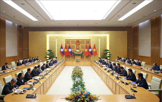 Thủ tướng Phạm Minh Chính hội kiến Tổng Bí thư, Chủ tịch nước Lào Thongloun Sisoulith. Ảnh: Dương Giang– TTXVN
