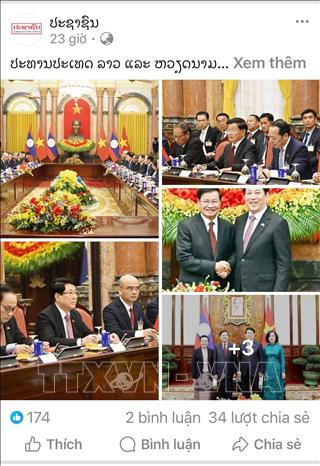 Bài viết Chủ tịch nước hai nước Việt Nam - Lào gặp song phương trên báo Pasaxon. Ảnh: Xuân Tú - PV TTXVN tại Lào