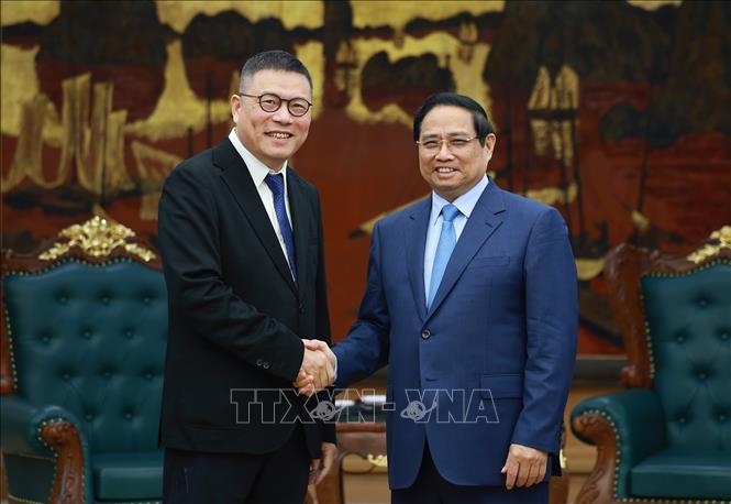 Thủ tướng Phạm Minh Chính tiếp ông Hồng Thiên Chúc, Chủ tịch Tập đoàn Texhong (Trung Quốc). Ảnh: Dương Giang-TTXVN 
