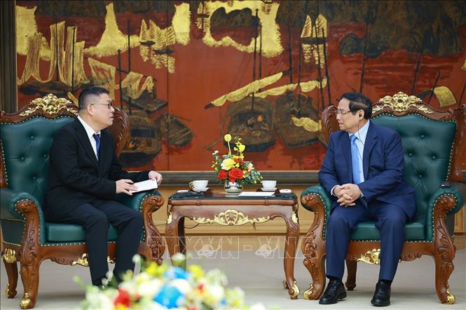 Thủ tướng Phạm Minh Chính tiếp ông Hồng Thiên Chúc, Chủ tịch Tập đoàn Texhong (Trung Quốc). Ảnh: Dương Giang-TTXVN 
