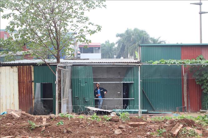 Lực lượng chức năng tổ chức cưỡng chế nhanh, đúng theo quy định pháp luật. Ảnh: Nguyễn Thắng - TTXVN