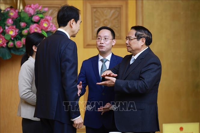 Thủ tướng Phạm Minh Chính tiếp Đại sứ Trung Quốc tại Việt Nam Hà Vĩ. Ảnh: Dương Giang -TTXVN 
