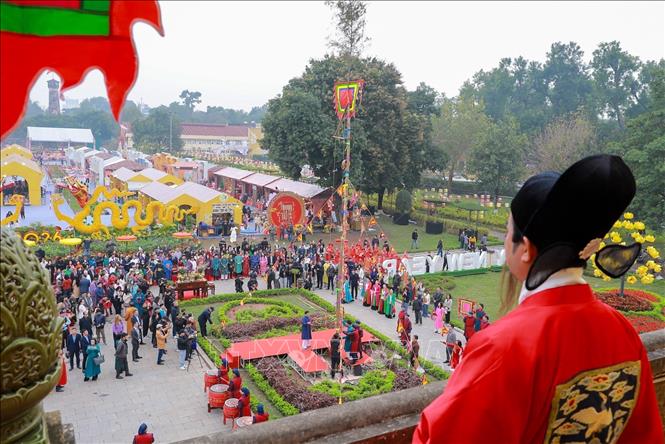 The Thuong tieu ceremony features the ceremonial New Year pole erected to ward off evil spirits and welcome spring. VNA Photo: Khánh Hoà 