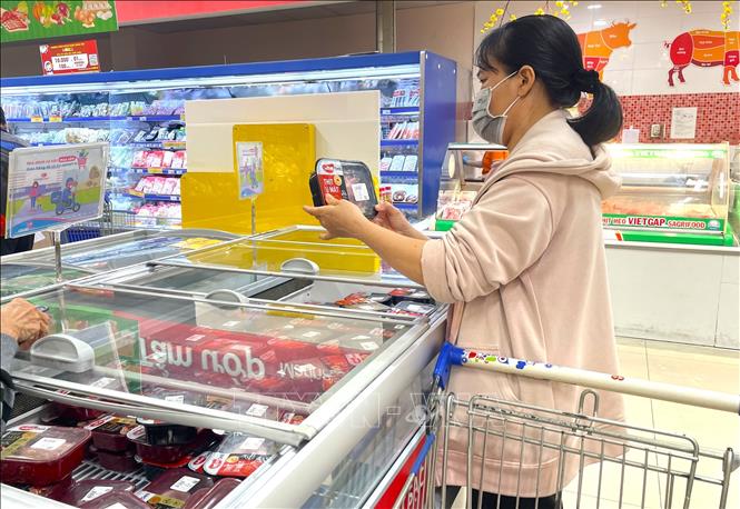 Chương trình bình ổn thị trường tại TP. Hồ Chí Minh giúp người dân tiếp cận mặt hàng thịt lợn với giá ổn định, không biến động bởi cung - cầu.  Ảnh: Hương Giang - TTXVN
