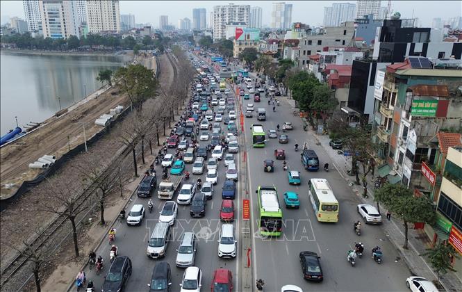 Đường Giải Phóng lưu lượng giao thông tăng cao hướng đi quốc lộ 1A cũ. Ảnh: Quốc Khánh - TTXVN