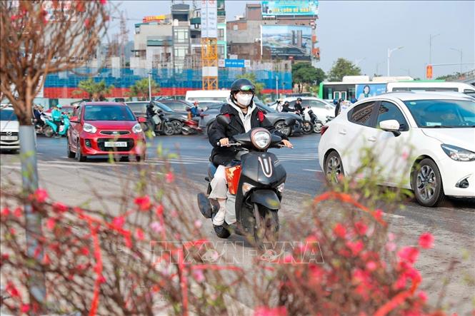 Người dân trở về quê ăn Tết sáng 14/2/2026. Ảnh: Minh Quyết - TTXVN