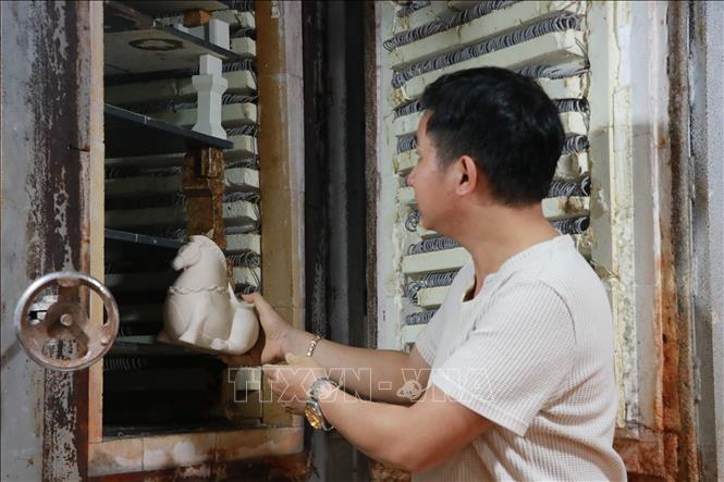 This year’s horses are chubby with short legs, exuding an aristocratic charm, symbolising accumulation and ease. VNA Photo: Khoa Chương