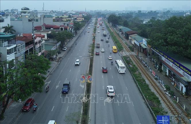 Đường Nguyễn Văn Linh thông thoáng, phương tiện lưu thông ổn định cả hai chiều. Ảnh: Phan Phương – TTXVN