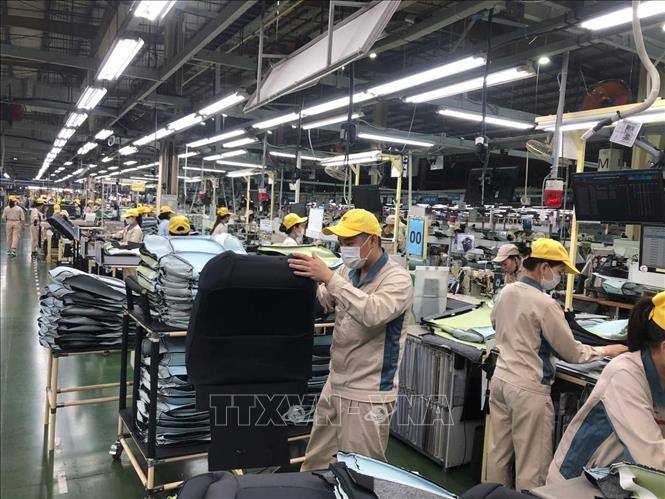 Production at the Toyota Boshoku Hanoi Co. Ltd., a Japanese-invested automotive interior manufacturer. VNA Photo: Minh Nghĩa
