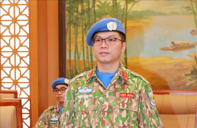 Trung tá Nguyễn Hoàng Long tại lễ trao quyết định. Ảnh: Trọng Đức - TTXVN  Ảnh: Trọng Đức - TTXVN