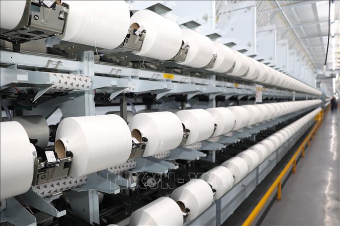 Nhà máy sợi thuộc Công ty TNHH Sợi dệt nhuộm Unitex áp dụng công nghệ mới tối ưu hoá hoạt động theo mô hình tự động. Ảnh: Thanh Tân - TTXVN