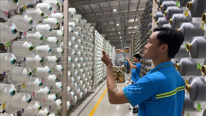 Người lao động ở Công ty TNHH PNS CHUN (KCN VsipTịnh Phong, Quảng Ngãi) trở lại làm việc sau kỳ nghỉ Tết Nguyên đán 2026. Ảnh: Hải Âu-TTXVN