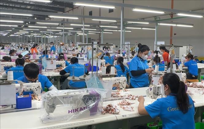 Người lao động ở Công ty TNHH Quốc Tế Great Honor (KCN Vsip Tịnh Phong, Quảng Ngãi) trở lại làm việc sau kỳ nghỉ Tết Nguyên đán 2026. Ảnh: Hải Âu-TTXVN 