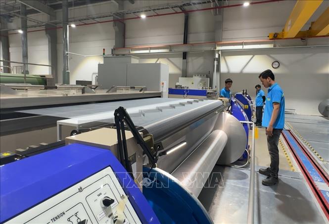 Người lao động ở Công ty TNHH PNS CHUN (KCN Vsip Tịnh Phong, Quảng Ngãi) trở lại làm việc sau kỳ nghỉ Tết Nguyên đán 2026. Ảnh: Hải Âu-TTXVN 