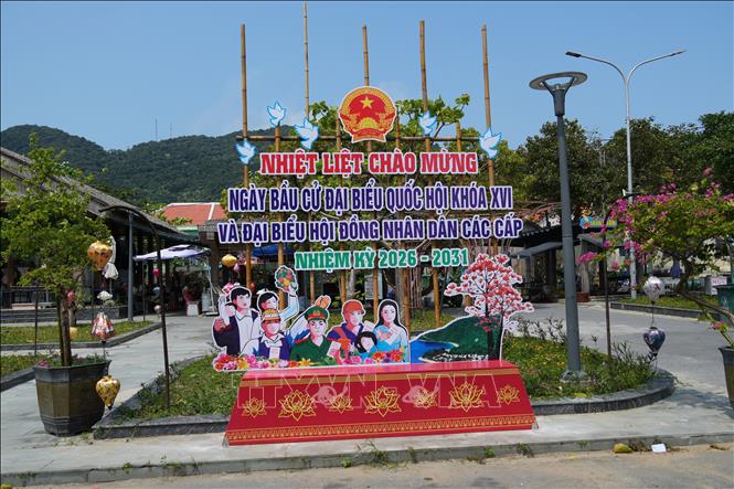 Large visual banners and posters promoting the National Assembly and People’s Council elections are displayed at public venues across Tan Hiep island commune. Photo: Anh Dung – VNA