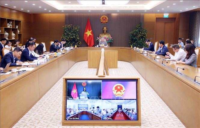 Permanent Deputy Prime Minister Nguyen Hoa Binh chairs a meeting in Hanoi on March 6 to review the development strategy and operational framework for the international financial centre. Photo: Pham Kien – VNA