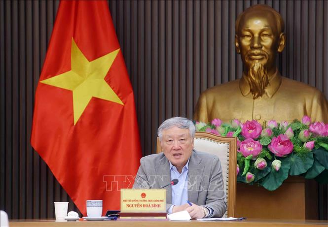 Permanent Deputy Prime Minister Nguyen Hoa Binh chairs a meeting in Hanoi on March 6 to review the development strategy and operational framework for the international financial centre. Photo: Pham Kien – VNA