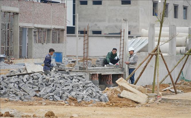 Thi công hạ tầng kỹ thuật Cụm công nghiệp Quảng Chu, xã Chợ Mới. Ảnh: Hoàng Nguyên - TTXVN