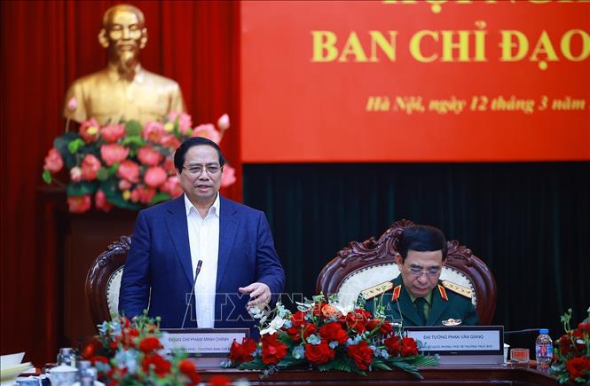 Thủ tướng Phạm Minh Chính làm việc với Bộ Quốc phòng và các bộ, ngành về kết quả hoạt động nghiên cứu, sản xuất, phát triển công nghiệp quốc phòng. Ảnh: Dương Giang-TTXVN 
