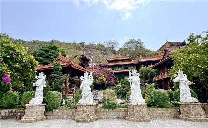 Statues of the four Guardian Deities looking down at the foot of Sam mountain. VNA Photo: Thanh Sang