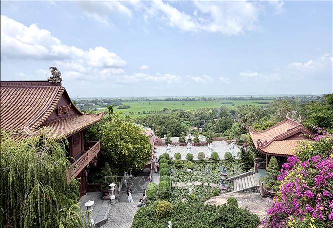 The courtyard of Hang Pagoda overlooks rice fields at the foot of Sam mountain. VNA Photo: Thanh Sang