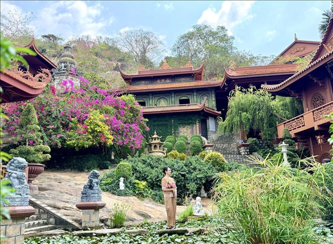 The pagoda is covered with rows of red tile roofs, creating a warm and inviting atmosphere. VNA Photo: Thanh Sang