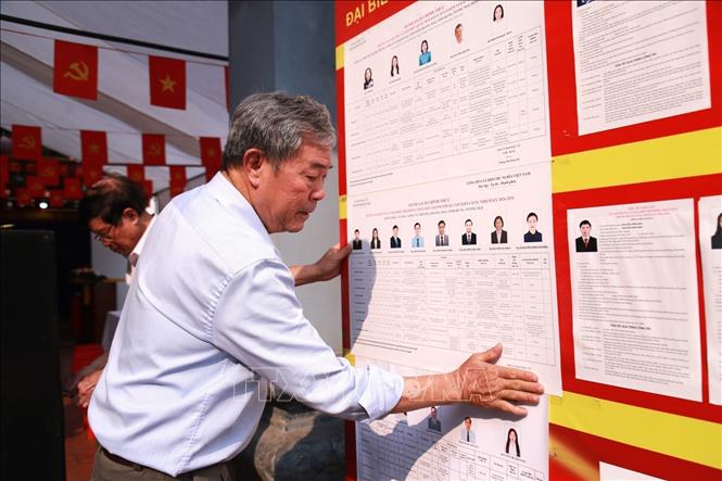 Candidates biographies are publicly posted at the polling stations in Vinh Hung ward of Hanoi. VNA Photo