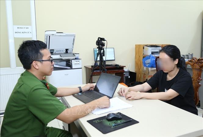 Một bị can làm việc với cơ quan công an. Ảnh: TTXVN phát