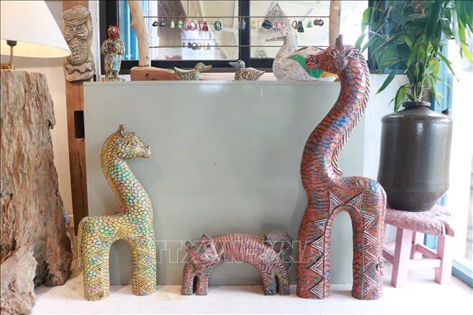 Each piece of artwork made from firewood is unique as they are made by hands. VNA Photo