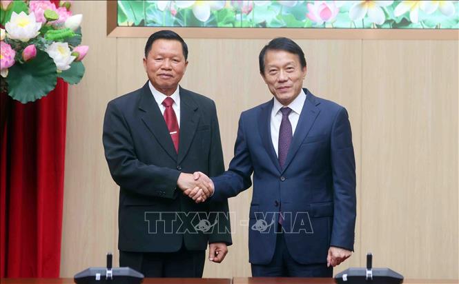 Đại tướng Lương Tam Quang, Bộ trưởng Bộ Công an Việt Nam với Thượng tướng Vanthong Kongmany, Bộ trưởng Bộ Công an Lào. Ảnh: Phạm Kiên - TTXVN