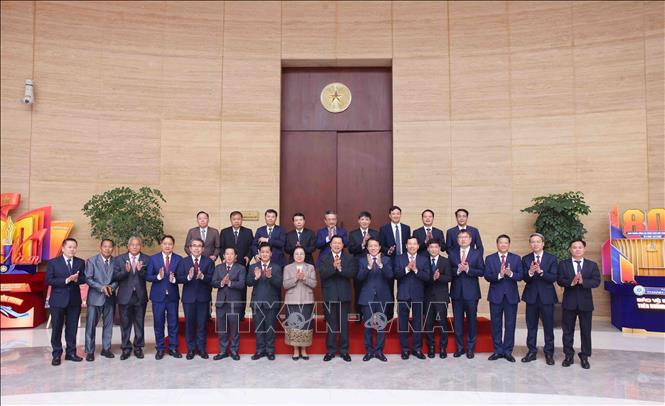 Đại tướng Lương Tam Quang, Bộ trưởng Bộ Công an Việt Nam và Thượng tướng Vanthong Kongmany, Bộ trưởng Bộ Công an Lào với các đại biểu. Ảnh: Phạm Kiên - TTXVN