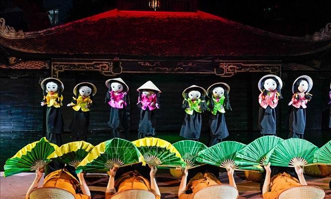 Tiết mục nghệ thuật tại chương trình. Ảnh: Khánh Hoà - TTXVN
