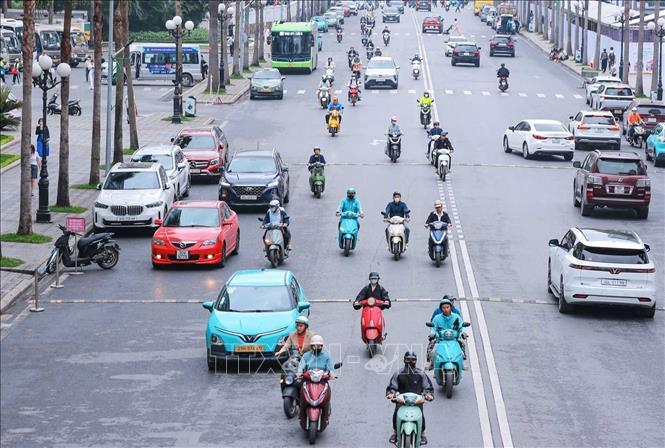 Electric vehicles are becoming increasingly common in people's daily lives.  VNA Photo: Hoàng Hiếu