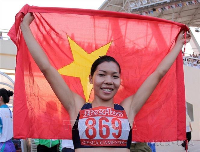 Nữ hoàng tốc độ Vũ Thị Hương vui mừng sau khi đoạt HCV nội dung 100m nữ tại SEA Games 25 (Lào, 2009). Ảnh:Quốc Khánh-TTXVN