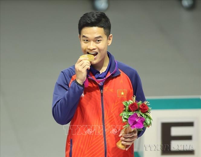 Thể thao Việt Nam có HCV đầu tiên ở ASIAD 19 của xạ thủ Phạm Quang Huy ở nội dung súng ngắn hơi 10m cá nhân nam. Ảnh: TTXVN phát