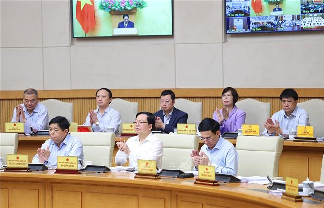 Thành viên Chính phủ và các đại biểu tham dự Phiên họp Chính phủ thường kỳ tháng 3 năm 2026 và Hội nghị Chính phủ trực tuyến với địa phương. Ảnh: Dương Giang-TTXVN 
